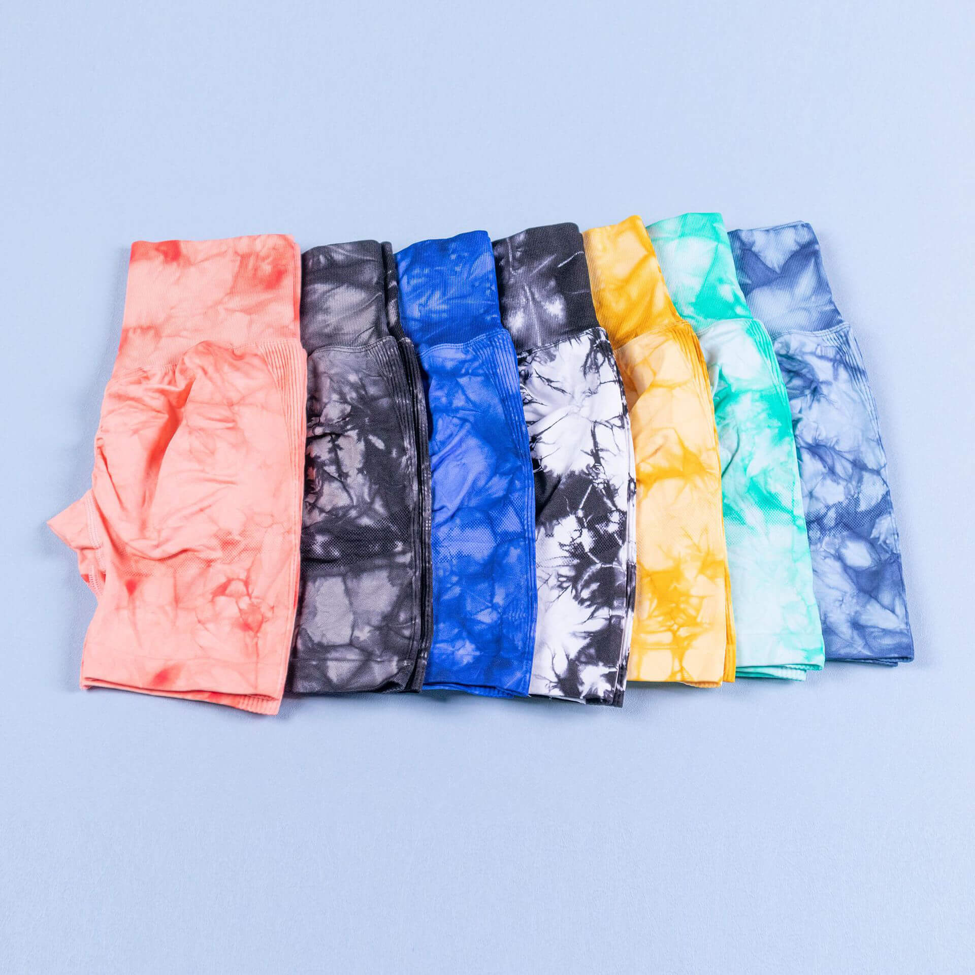 Display of multicolored seamless sports scrunch butt shorts for women, perfect for yoga and fitness, with high-waist design.
